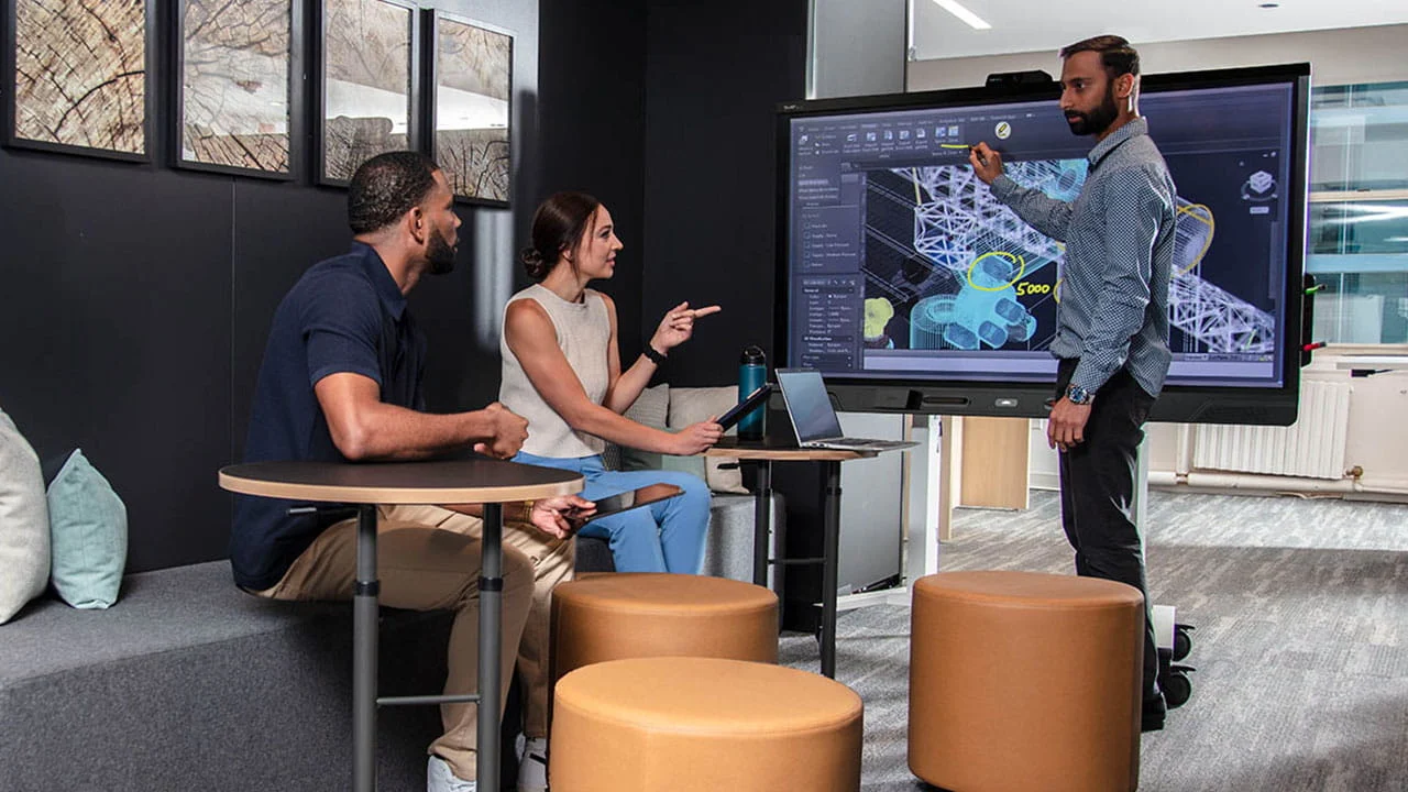 Team collaboration meeting with interactive display